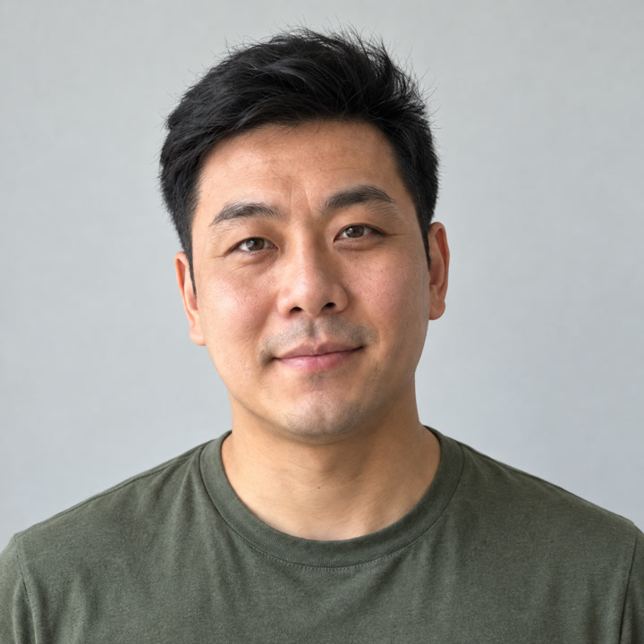Fictional adult input portrait with short dark hair and a green shirt